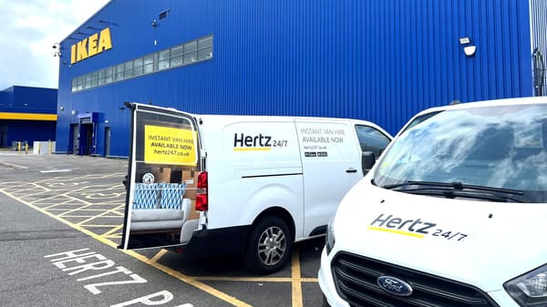 Hertz van rentals parked outside an IKEA store.