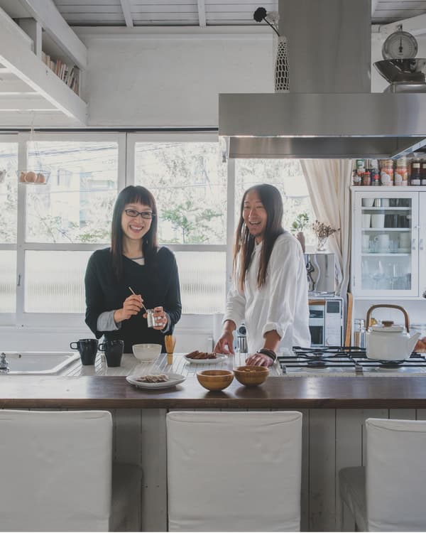 Homeowner Kaoli with partner Shige in the kitchen of their small Tokyo home.