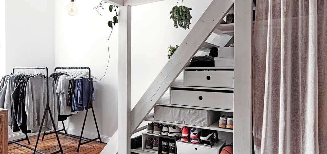 How to use an awkward space under the stairs for storage