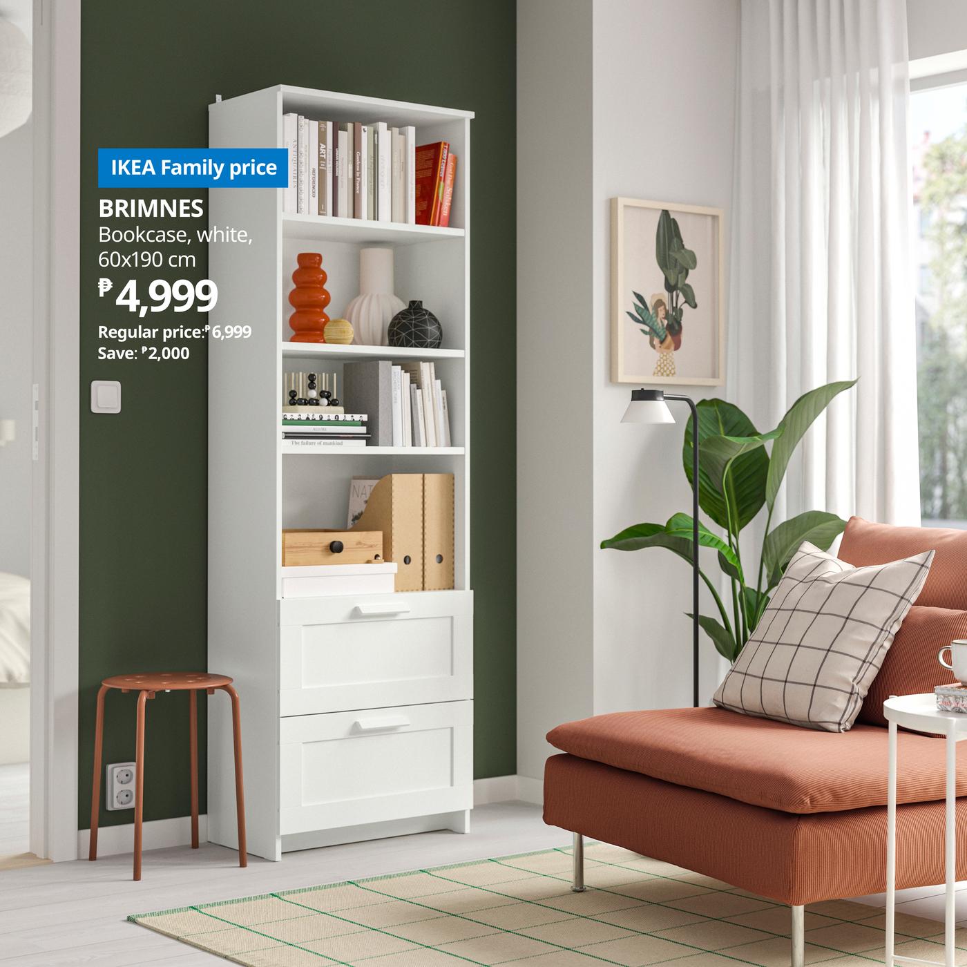 IKEA ad for a white BRIMNES bookcase with drawers, priced at 4,999, beside a rust-colored sofa and leafy plant in a calm, bright living room.