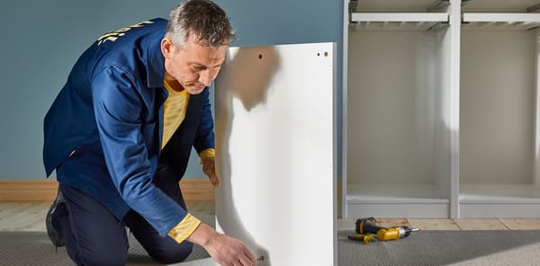 IKEA co-worker assembling furniture