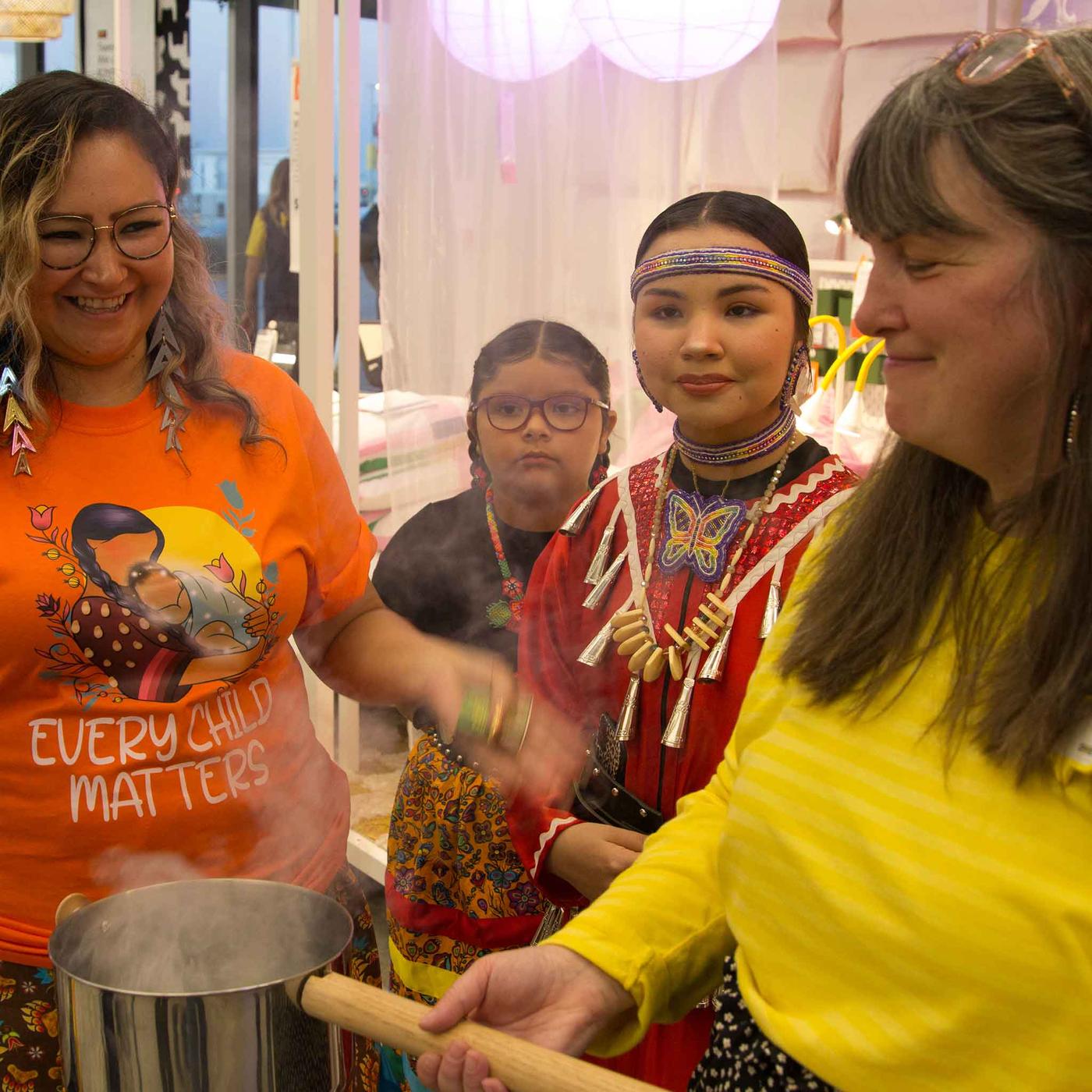 IKEA co-worker participating in the smudging ceremony.
