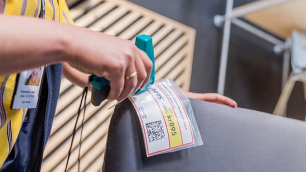 IKEA co-worker scanning IKEA product's label. 