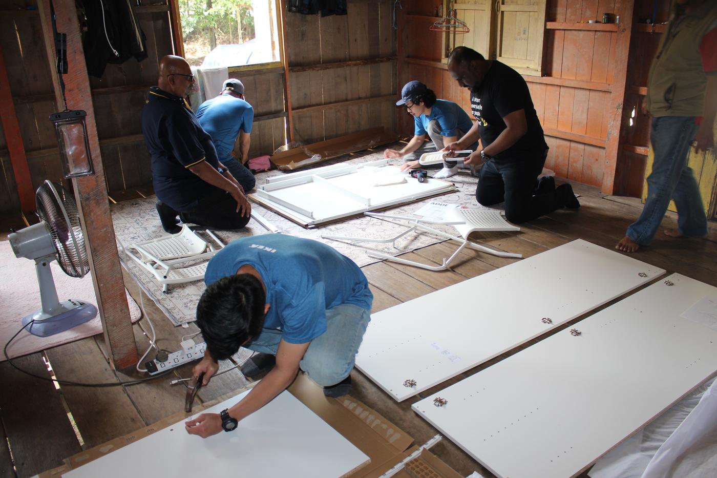 IKEA co-workers is helping the family to assemble their new KLEPPSTAD wardrobes