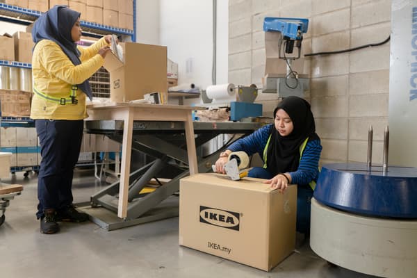 IKEA coworkers are packing customer orders to be delivered to their home