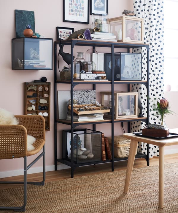 IKEA FJÄLLBO storage unit used to display geological finds in a living room setting.