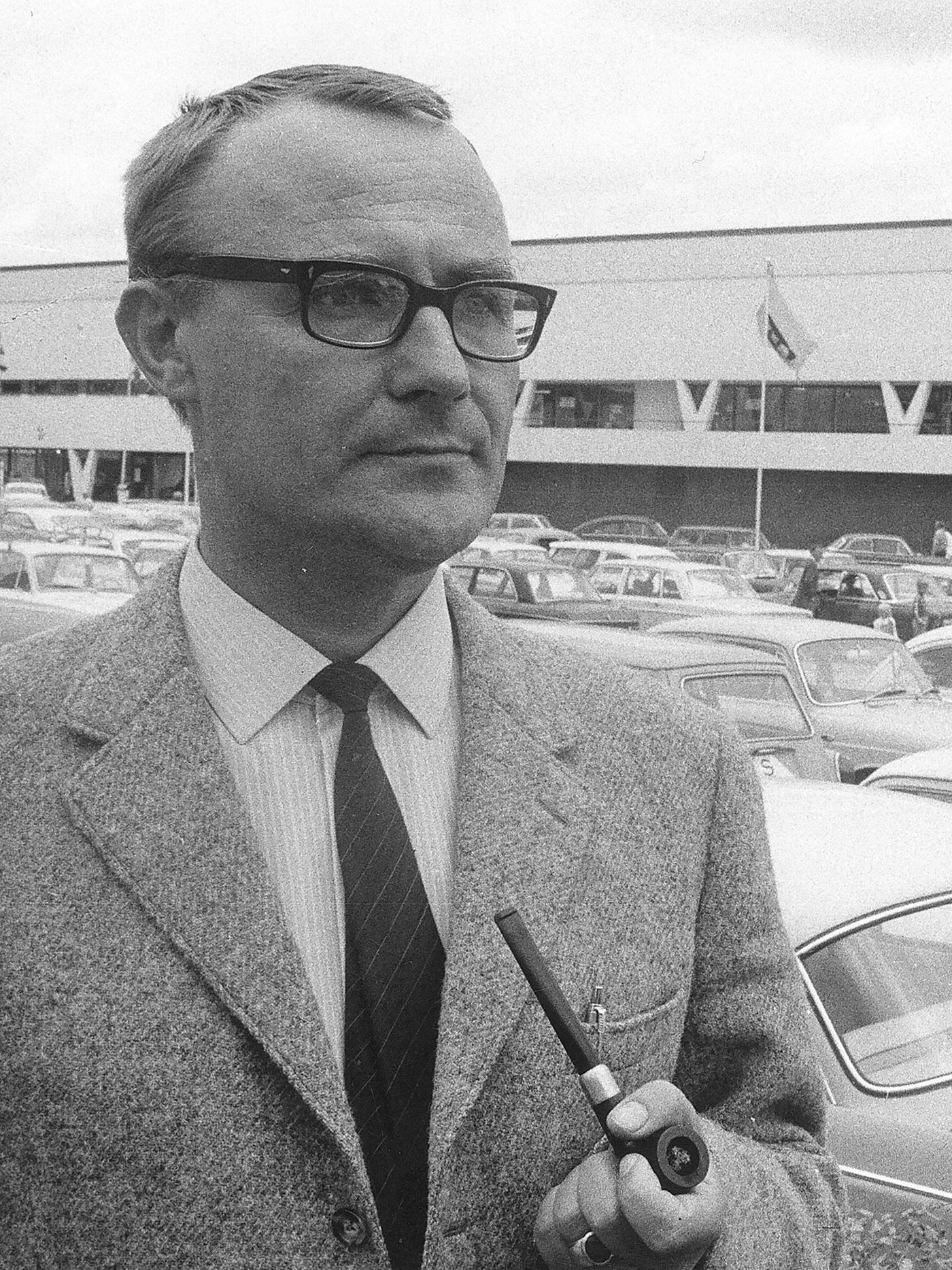 IKEA founder Ingvar Kamprad smoking a pipe in the carpark of the first IKEA store in Älmhult.