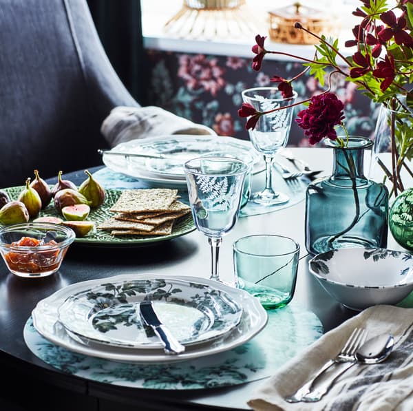IKEA FRAMTRÄDA clear glassware on a table setting.