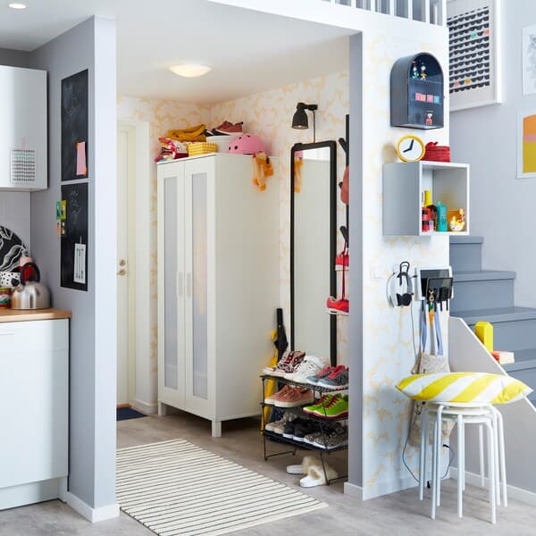 IKEA GREJIG black net shoe rack and white ANABODA small wardrobe closet are small space solutions to organise your tiny hallway without feeling crowded.