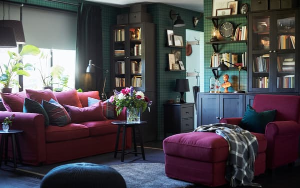 IKEA GRÖNLID red 2-seater sofa bed and armchair with long chaise in a dark green wallpaper living room.