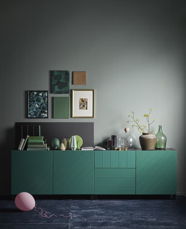 IKEA has a variety of green cabinets like BESTÅ storage combination in blue-green. The modern, rectangular cabinet has a black-brown frame, two soft-closing drawers and a push-open door.