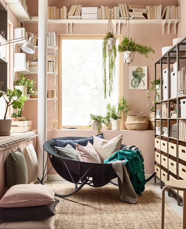 IKEA has lots of decorating tips for living rooms. For a relaxing feel, go for a bowl-shaped pappasan like IKEA PS 2017 rocking chair in black. Mix in low seating with cushions and a rug. Use open shelving and storage boxes to display and declutter.