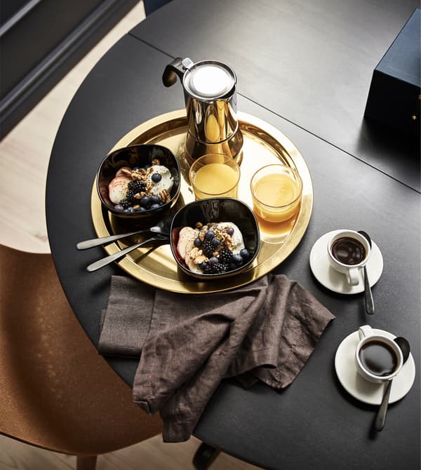 IKEA has lots of interior design ideas like having a table in your bedroom, so you can pretend you ordered room service. A GLATTIS round tray in brass-coloured, metallised stainless steel helps you carry in your food and adds eye-catching elegance.