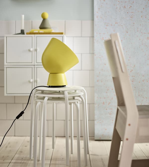 IKEA has lots of modern dining room furniture like MARIUS white plastic and coated steel. It’s stackable and lightweight with a circular top on thin, strong legs.