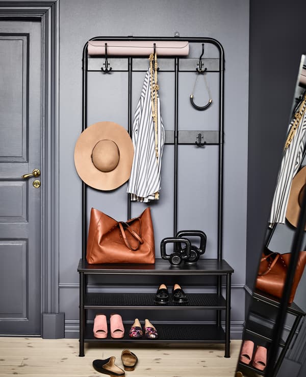 IKEA has lots of storage ideas like PINNIG coat rack in black powder-coated steel and zinc. With two rows of hooks, a bench and two shelvess, there’s space to put your things away when you walk in, which helps give your bedroom a calm and clean feel.