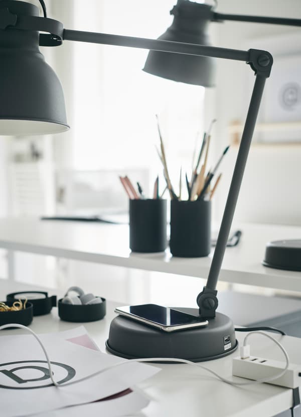 IKEA HEKTAR dark grey wireless charger work lamp provides directed task light and a place to recharge your phone. Place it at the base, or in its USB port.