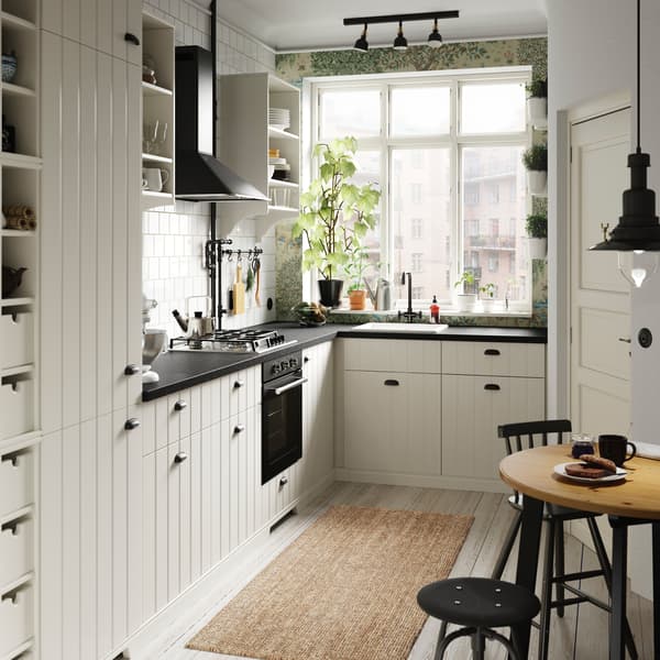 IKEA HITTARP white slatted kitchen door fronts with slats bring a country farmhouse style to this small kitchen.