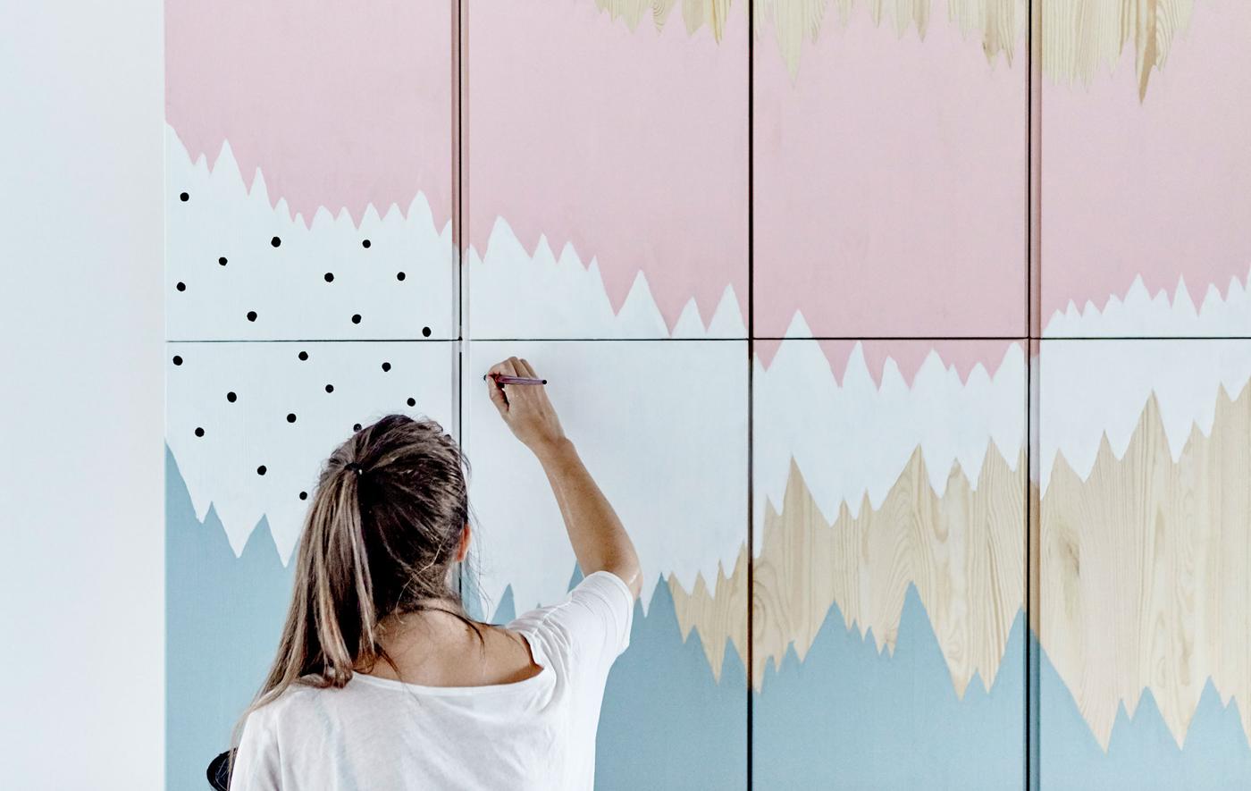 IKEA ideas stylist Therese painting a mural onto IVAR storage