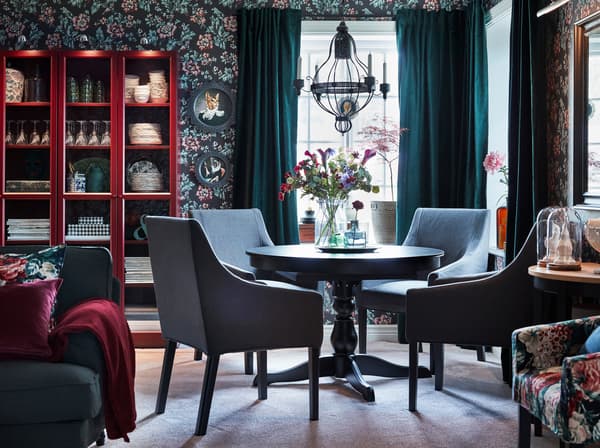 IKEA INGATORP black round extendable table and four SAKARIAS dining chairs in grey.