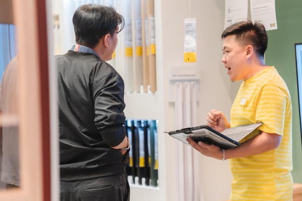 IKEA Kitchen specialist co-worker meeting with customer, free in-store kitchen consultation