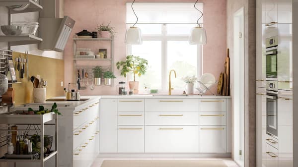 IKEA KUNGSFORS stainless steel kitchen with light pink walls.