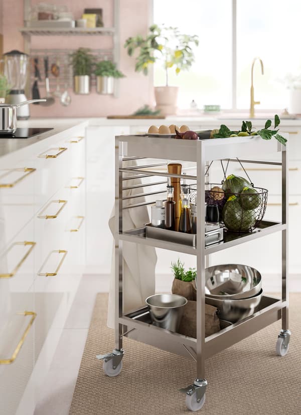 IKEA KUNGSFORS stainless steel trolley holding kitchenware and fresh produce.