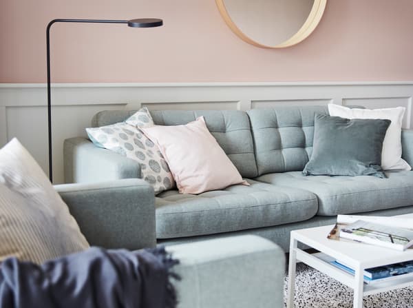 IKEA LANDSKRONA green plush sofa with GURLI, SANELA and TRÅDPALM pastel cushion covers.