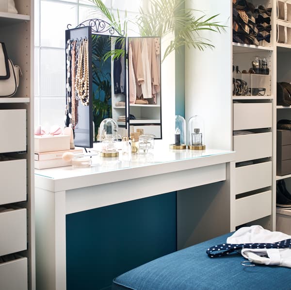 IKEA MALM white dressing table with KARMSUND black wire framed table mirror and SAMMANHANG mini glass display vases.