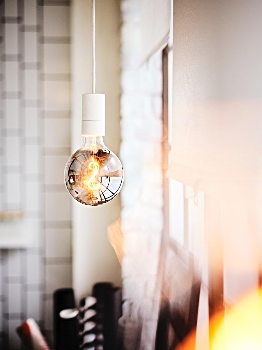 IKEA MOLNART LED light hanging from a cieling. 