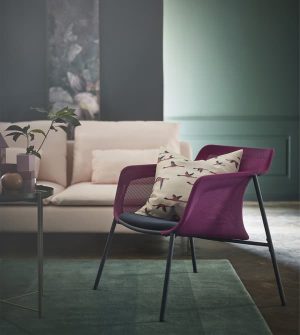 IKEA PS 2017 armchair is lightweight and modern with a woven mesh pink shell and a blue seat.