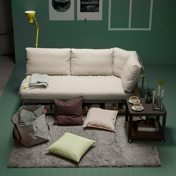 IKEA SANELA grey-green cushion covers are made of lush cotton velvet, and add a soft touch to the living room. TINGBY black fibreboard side table comes with castors and a bottom shelf for storage.