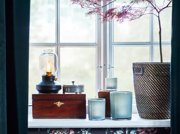 IKEA TÄRNABY kerosene styled table lamp on a windowsill.
