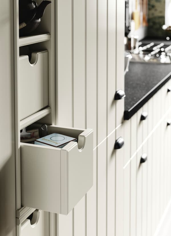 IKEA TORNVIKEN off-white kitchen storage box slid open.
