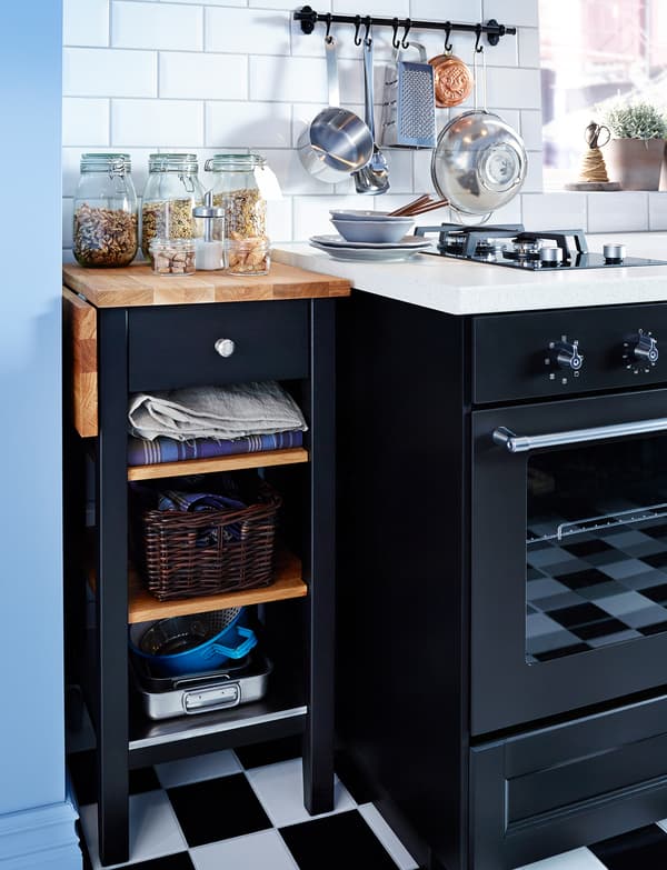 IKEA trolley, tucked next to the cooker, used as counter and storage space.