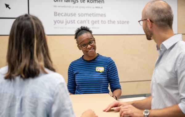 IKEA worker smiling to costumers