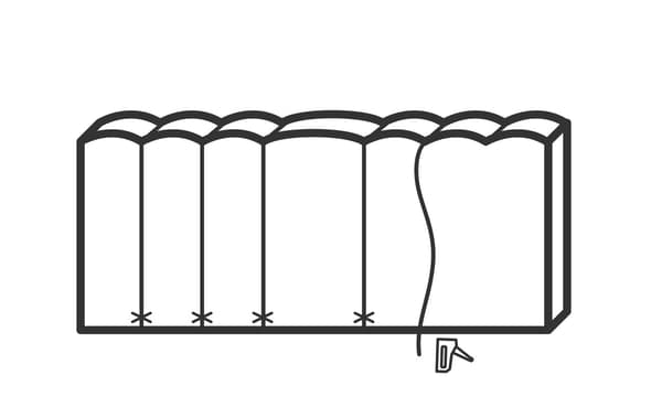 Illustration showing a thread being stapled into each groove and onto the front bottom of the headboard.