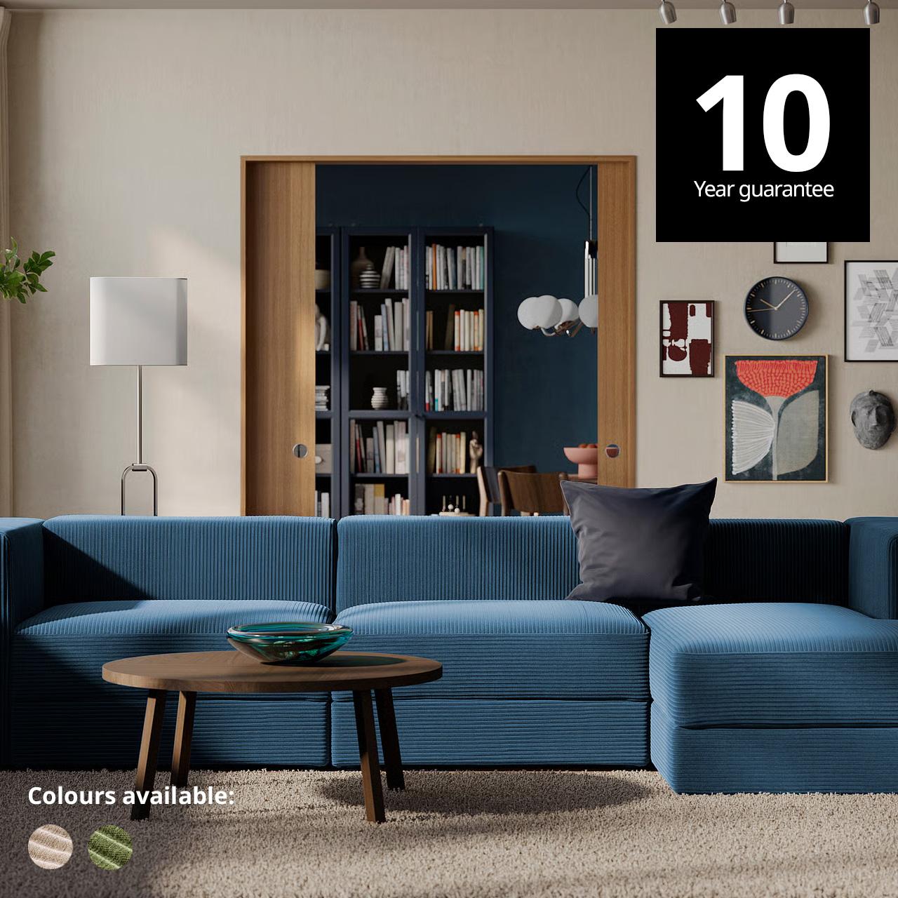 JÄTTEBO modular sofa in samsala dark blue colour  in spacious living room setting on top of a STOENSE off-white rug and a oak veneer STOCKHOLM 2025 coffee table.  A 10-year guarantee tag is placed over the image at the top right corner. White text overlay image that reads "Colours available:" with the colour swatch of Samsala grey-beige and Samsala dark yellow-green.