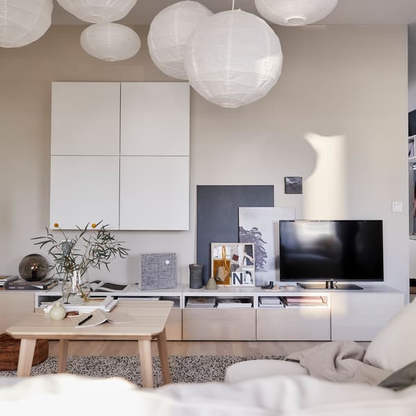 Keep your TV area tidy by using a bench with cable outlets at the back, such as IKEA BESTÅ TV bench in white/ash veneer.