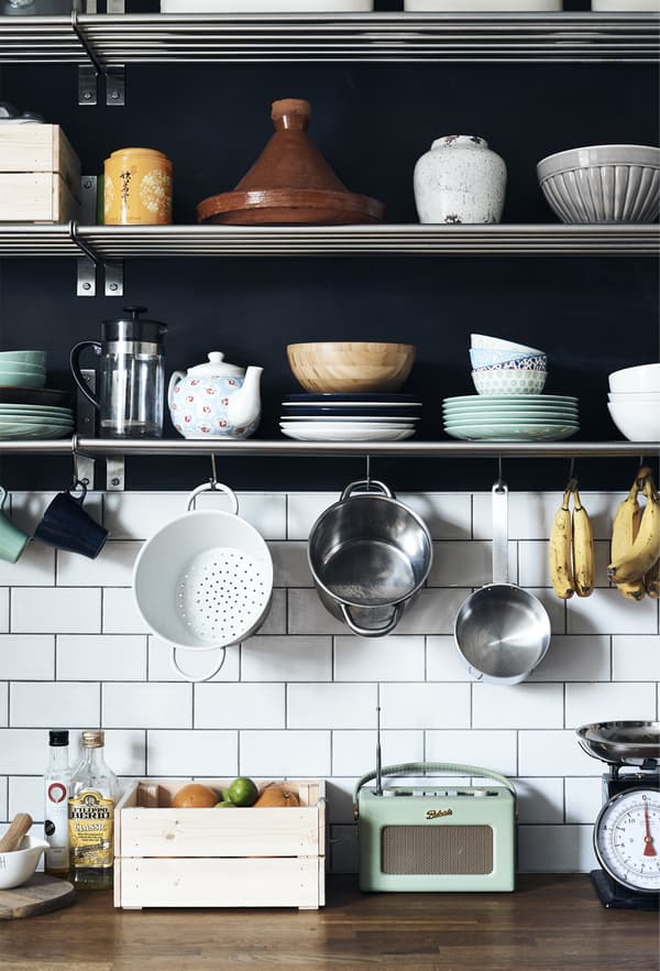 Kitchenware displayed on shelves.