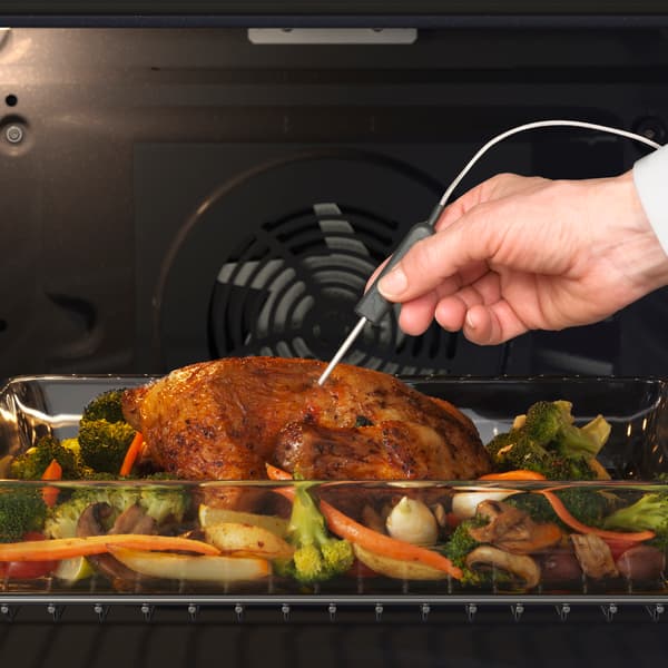 KULINARISK oven with a roast chicken cooking and a meat probe being used and a 