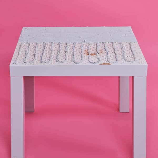LACK table's top is covered with tile adhesive.