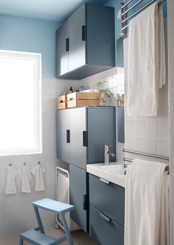 Looking for big storage in a small bathroom? One tip is to build your wall cabinets all the way to the ceiling using all your rooms height.