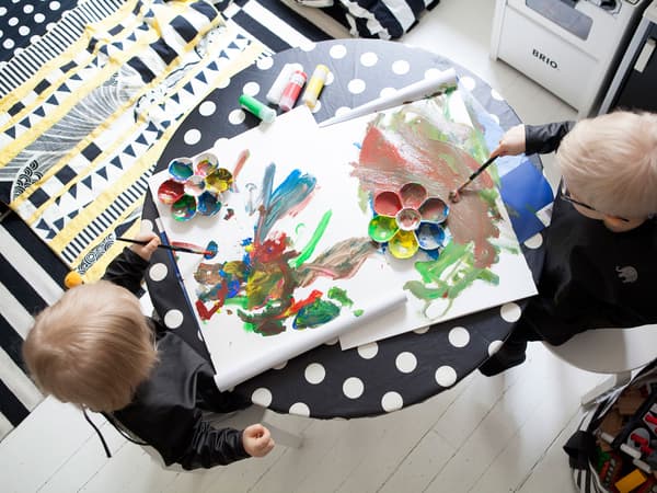 Make a table child-friendly with a wipe-clean cover for easy clean-ups.