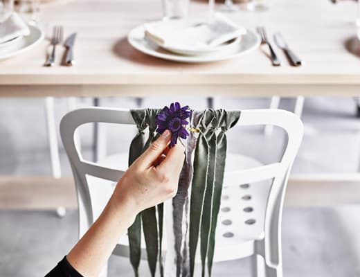 Make party seat decorations using strips of fabric and fabric flowers