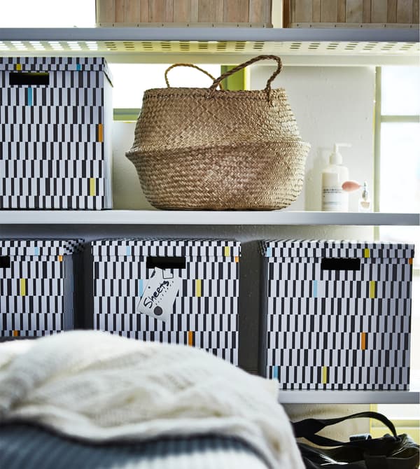 Make smart use of space with a shelving unit (MULIG) with lots of room to display the stuff you want to show off, or hide in boxes (TJENA), such as bed linen.