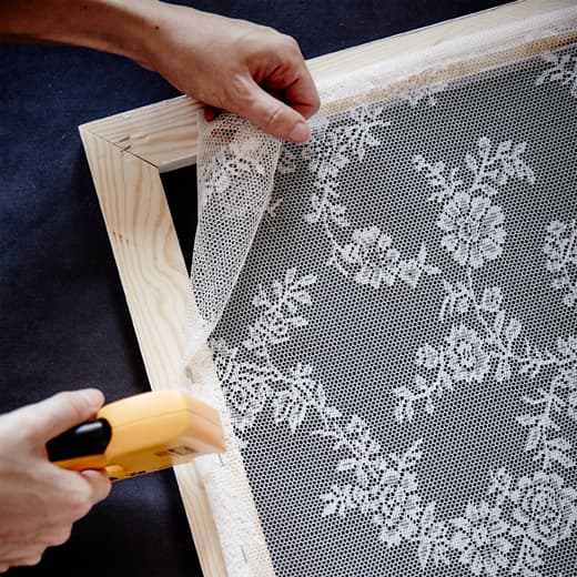 Make your lacy curtain frame by measuring out a wooden frame that fits the lower half of your window, then measure out a light lacy fabric and staple in place. After that just lean your textile frame in place and you’re done. Enjoy your autumn!