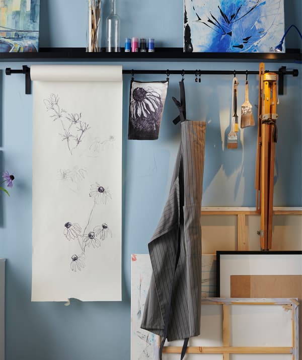 Make yourself a creative spot. Paint when you want to by using a paper roll, just pull down more paper when inspiration strikes. Try the IKEA MÅLA drawing paper roll.
