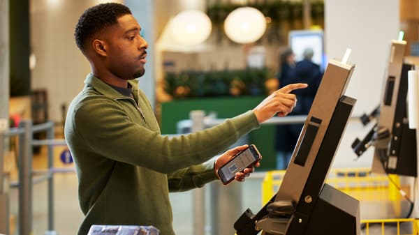 man using kiosk