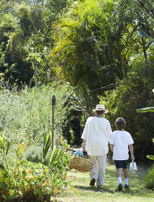 Margaret and her grandson in the garden