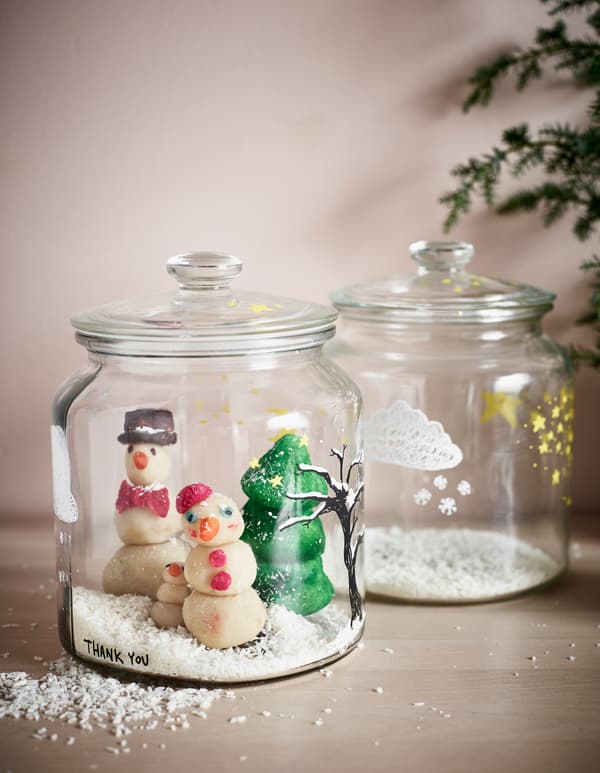 Marzipan trees and snow friends in a snow globe style glass jar.